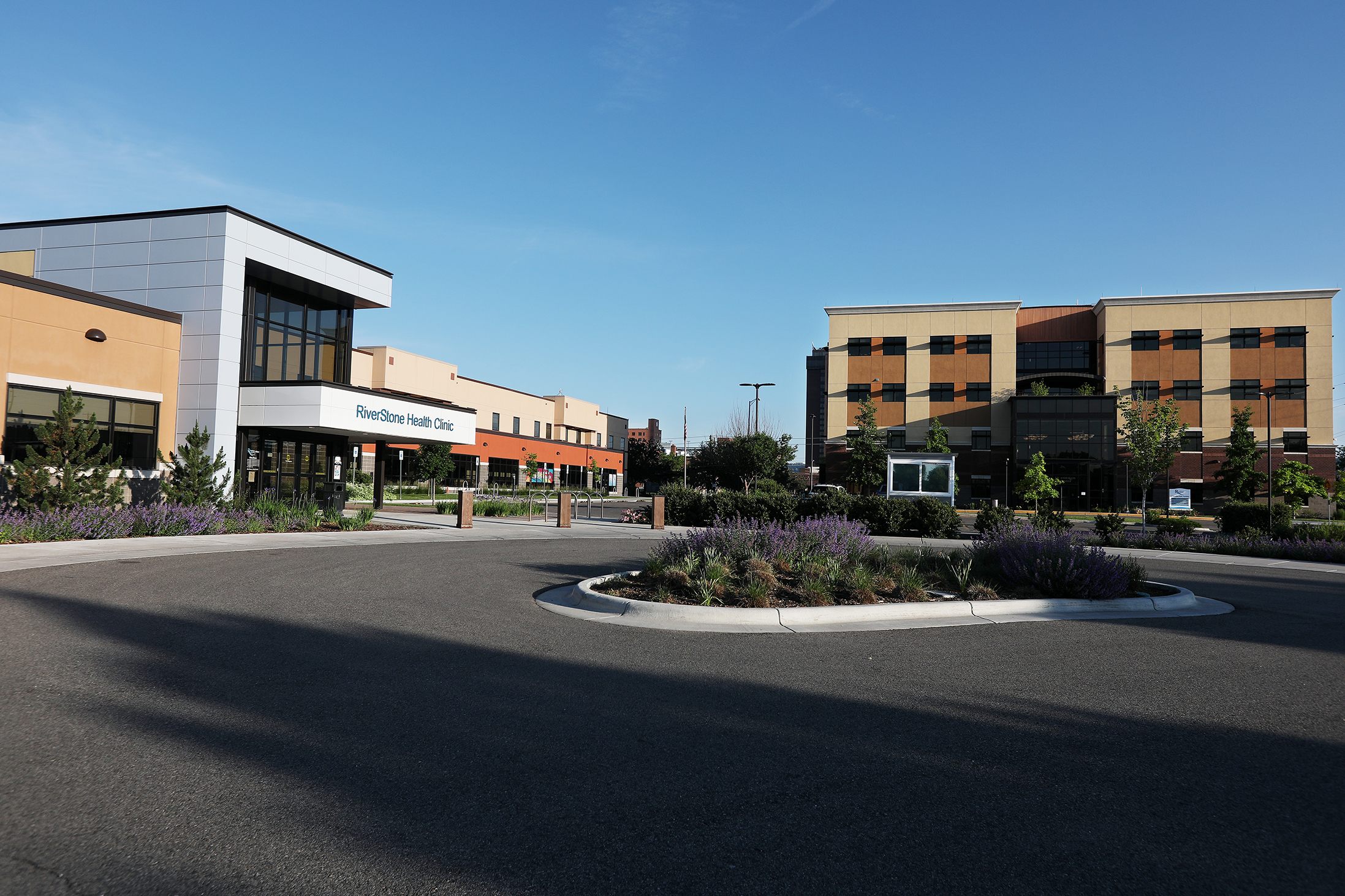 A wide-angle exterior photo of the RiverStone Health campus looking northwest.